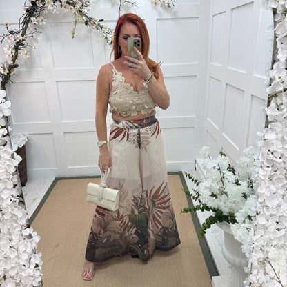Lyra: Cream tropical print wide leg sheer trousers. One size: 8-14