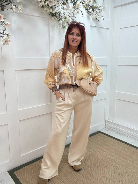 Tayla: Cream high waisted pleated wide leg trousers. One size: 10-16