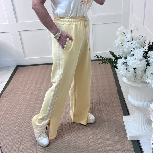 Sally: Lemon sports stripe wide leg trousers. One size: 12-18