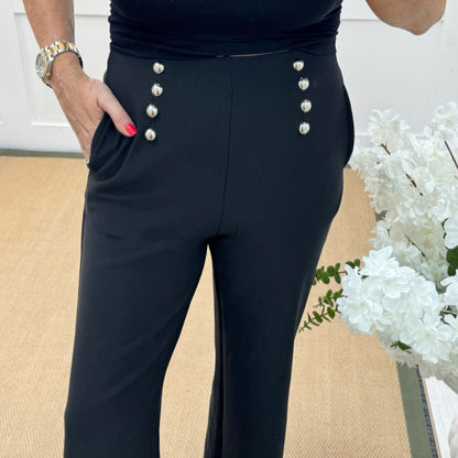 Paris: Black stretchy silver button trousers. 4 sizes