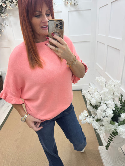 Sierra: Coral batwing fluted sleeve knitted top. One Size 12-18/20