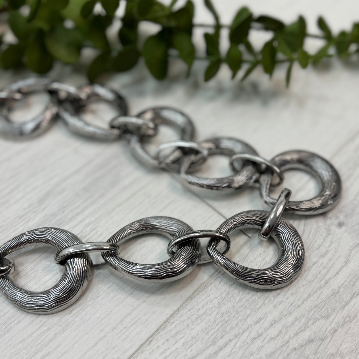 Fallon: Silver chain belt. One size: 8-18