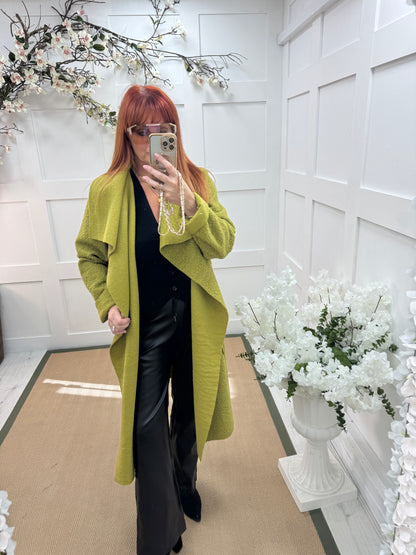 Kathie: Green boucle coat with pockets. One size 12-18