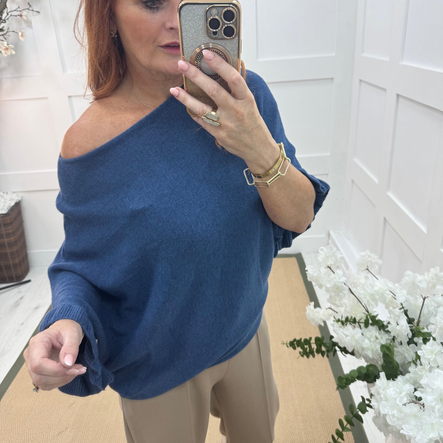 Sierra: Blue batwing fluted sleeve knitted top. One Size 12-18/20