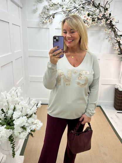 Cass: Stone V neck diamanté No5 knit top. One size: 14-20