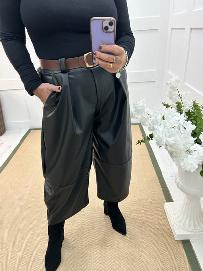 Allegra: Black 3/4 faux leather belted trousers. One size: 14-18