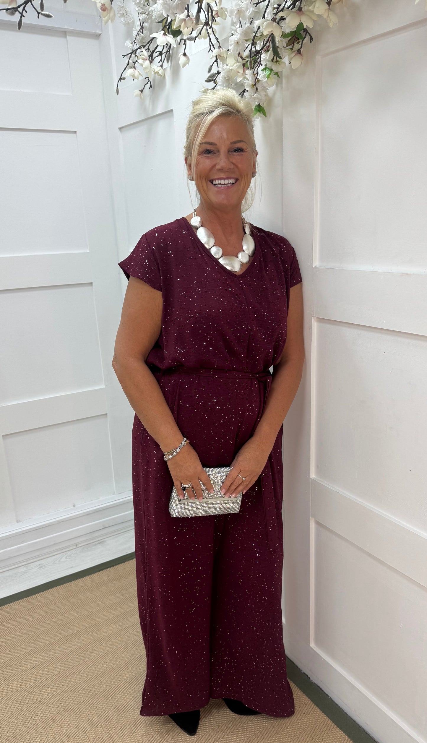 Gia: Burgundy sparkle tie-waist wide leg jumpsuit. One size: 12-18