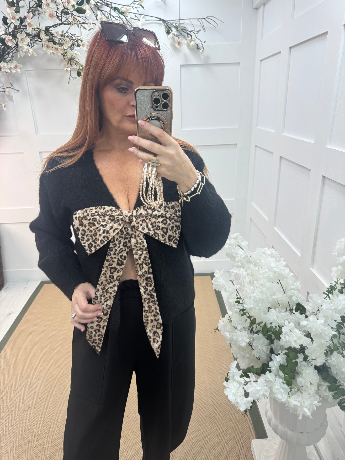 Jinx: Black wool leopard bow top. One size: 12-16