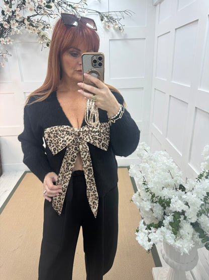 Jinx: Black wool leopard bow top. One size: 12-16