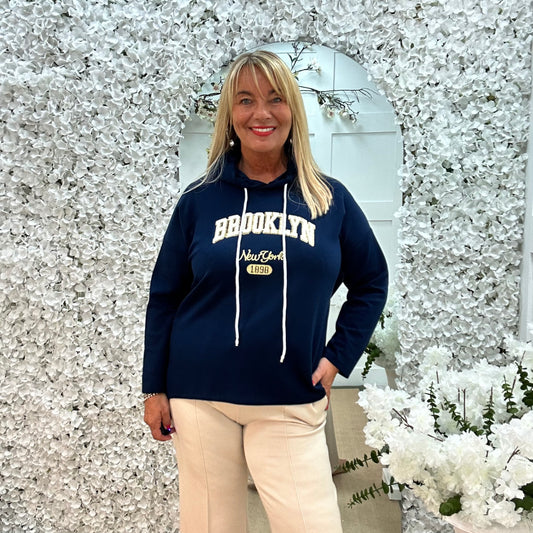 Madison: Navy Brooklyn logo hoodie. One size: 12-18
