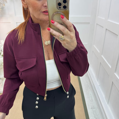 Bunty: Burgundy stretchy short bomber jacket. One size: 8-16