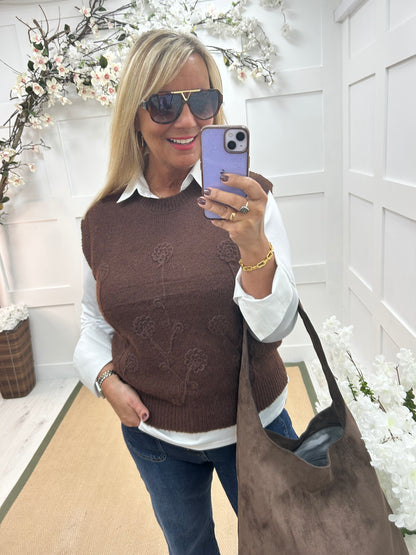 Larry: Brown sleeveless tank top with flower detail. One Sz: 12-18