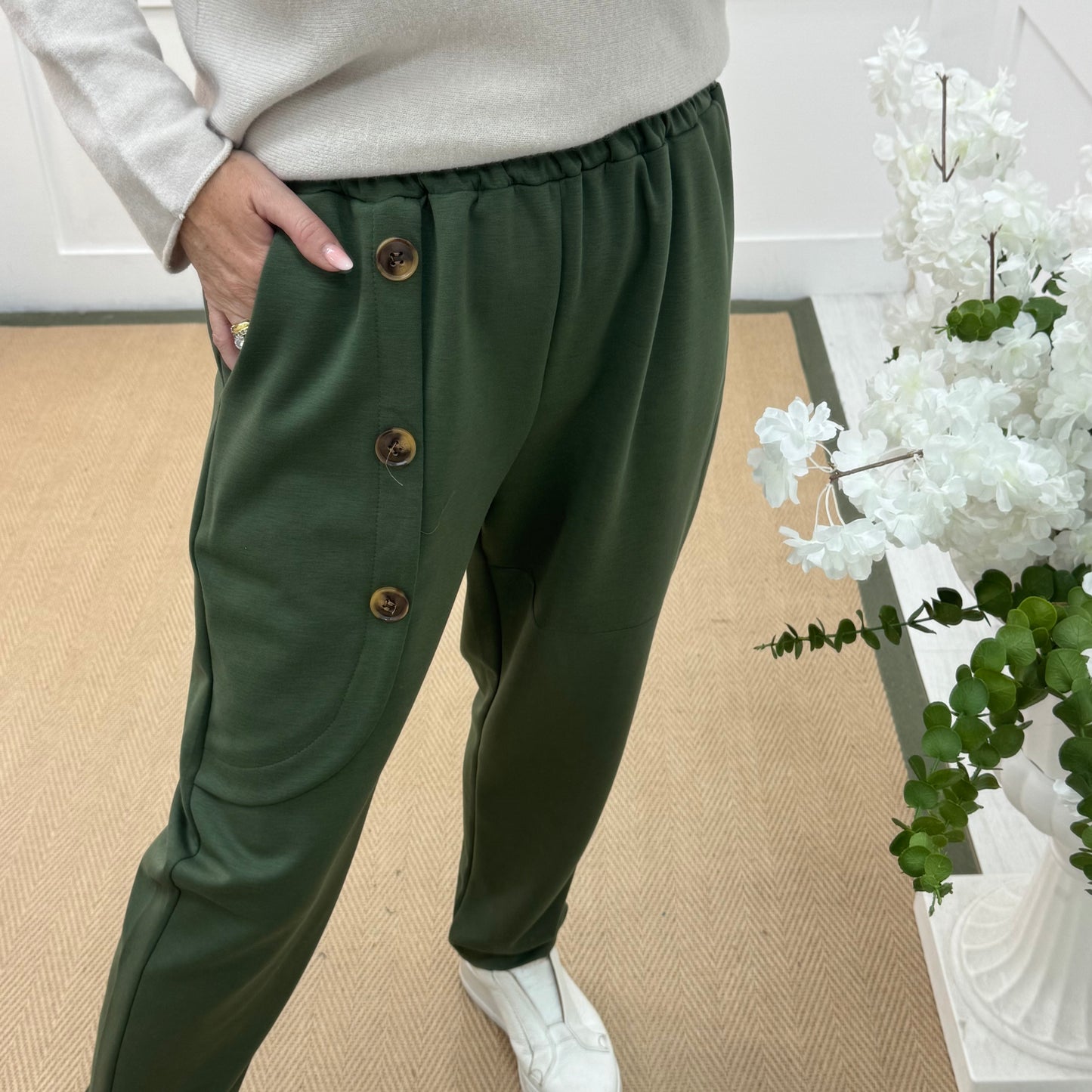 Monroe: Khaki stretchy button trousers. One size: 12-18