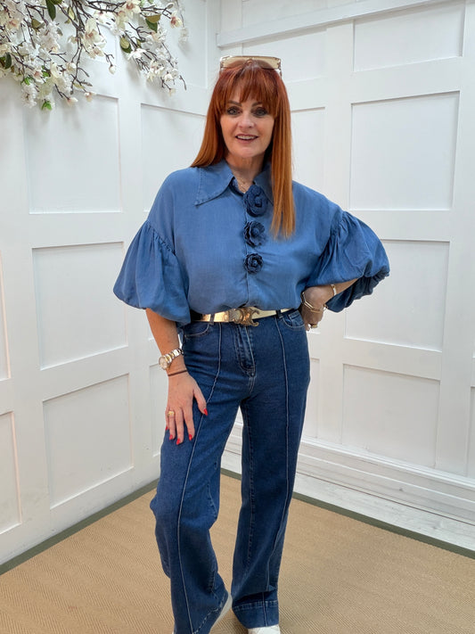 Poppy: Blue collared short sleeved floral shirt. 2 sizes.
