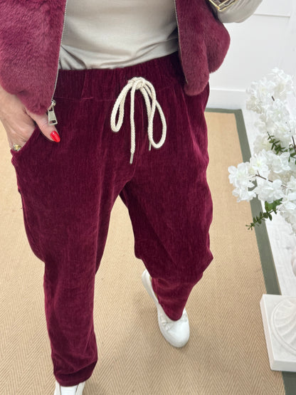 Velma: Burgundy velour trousers. One size: 12-18