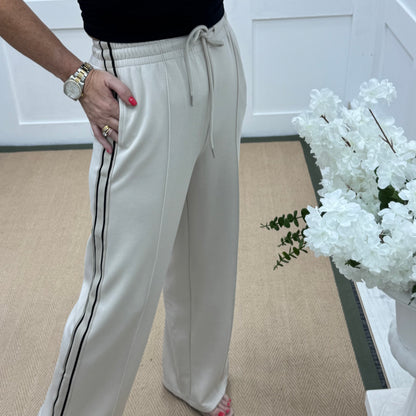Roxi: Cream stretchy pocket sports trousers. 3 sizes