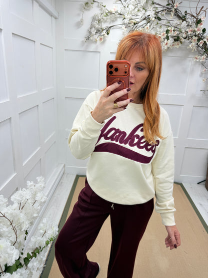 Yazmin: Cream & burgundy Yankee logo sweatshirt. One size: 12-16