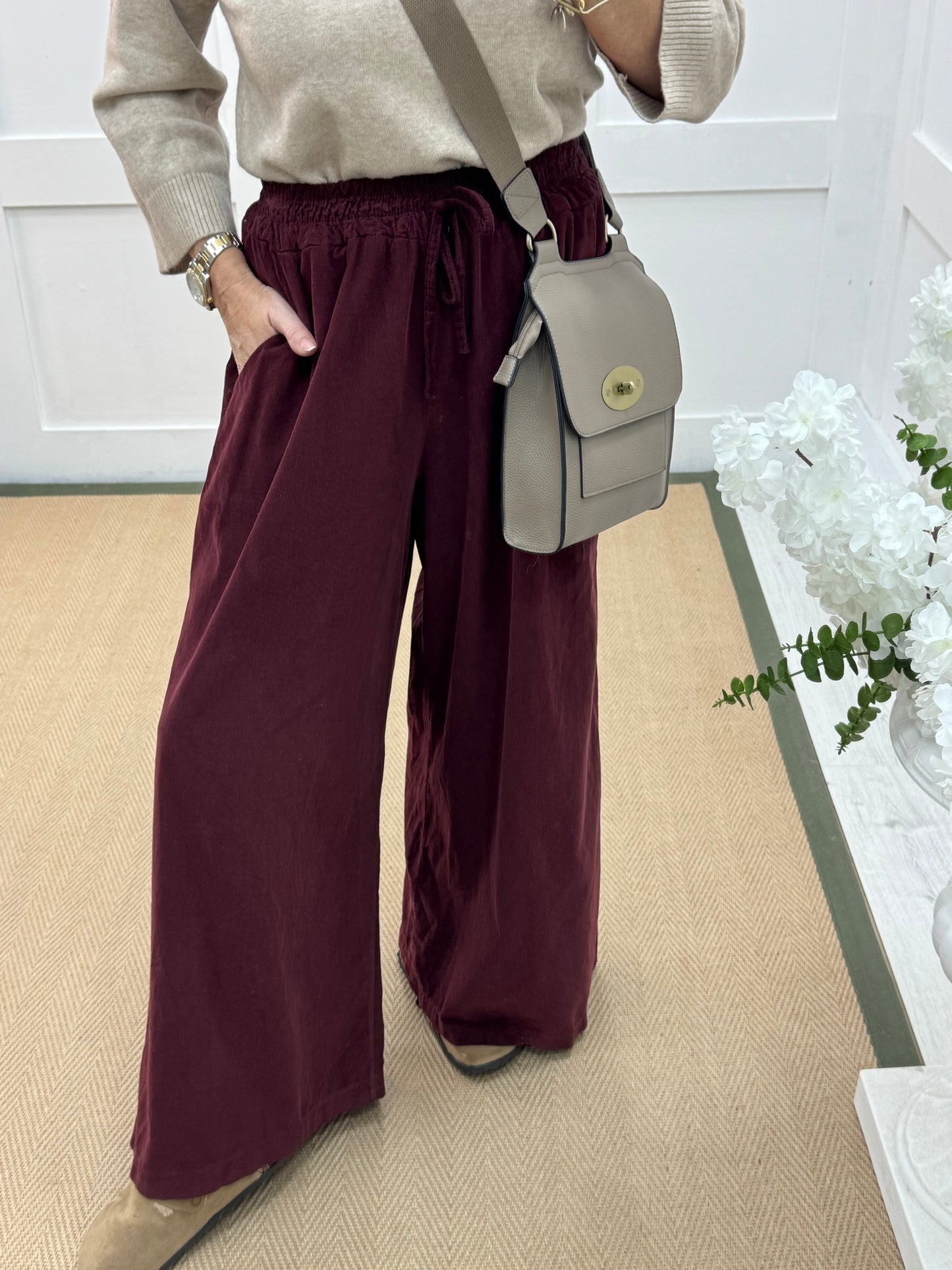 Lark: Burgundy needle cord wide trousers. One Size: 8-16
