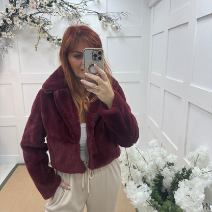 Paula: Burgundy short faux fur jacket . One size 10-16