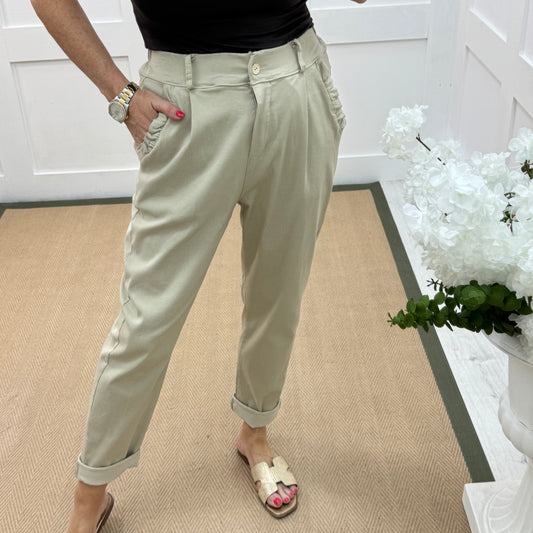Mandi: Cream stretchy frill pocket magic trousers with rear pockets. One Size: 14-20