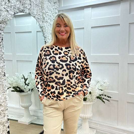 Pamela: Orange leopard print stretchy top. One size: 12-18