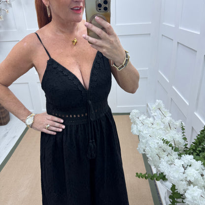 Bria: Black broderie Anglaise strappy jumpsuit. One size: 10-14
