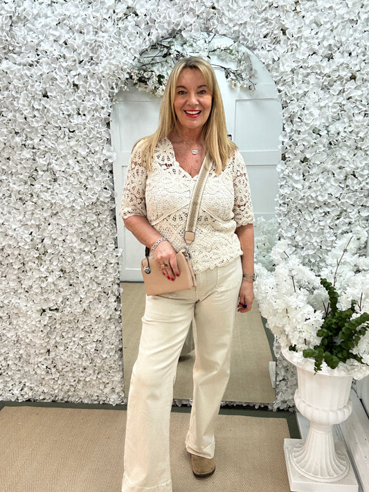 Ellie: Cream V neck short sleeved floral crochet top. One size: 10-16