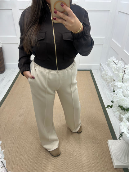 Trudy (Short): Cream stretchy wide leg pocket trousers. One size 10-16