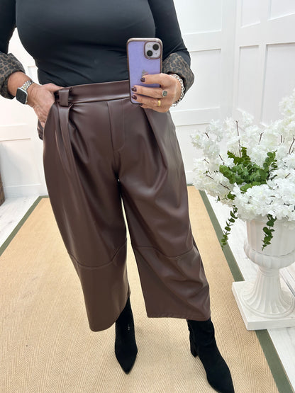 Allegra: Brown 3/4 faux leather belted trousers. One size: 14-18