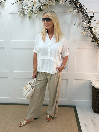 Sloane: 3/4 sleeve buttoned front elasticated waist top. One size: 14-20. 3 colours