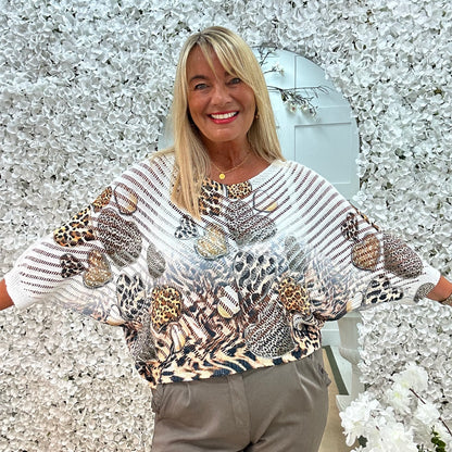 Luna: White leopard print heart V neck top. One size: 12-18