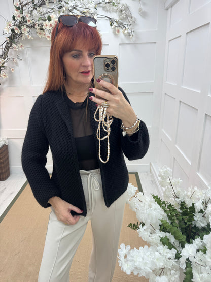 Skye: Black knitted boxcut cardigan. One size: 10-18