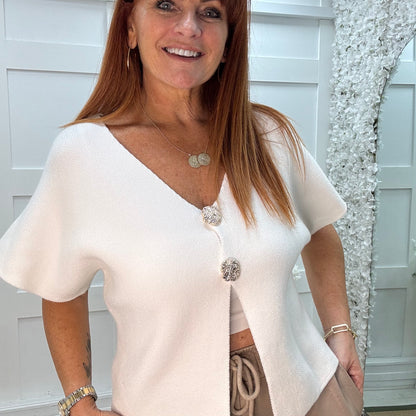 Sammi: White V neck gold button top. One size: 10-16
