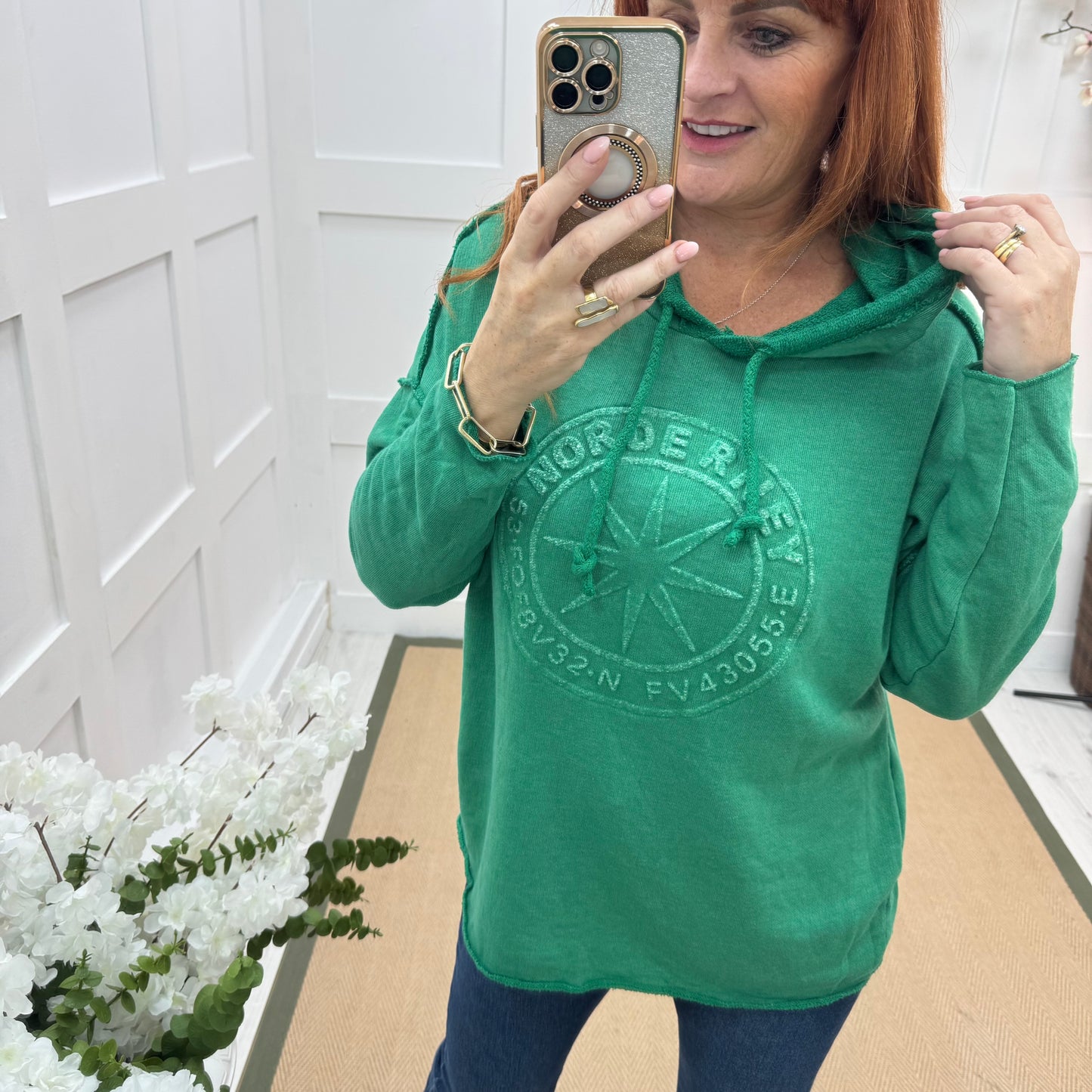 Sara: Emerald green hooded embossed compass top. One size: 12-18