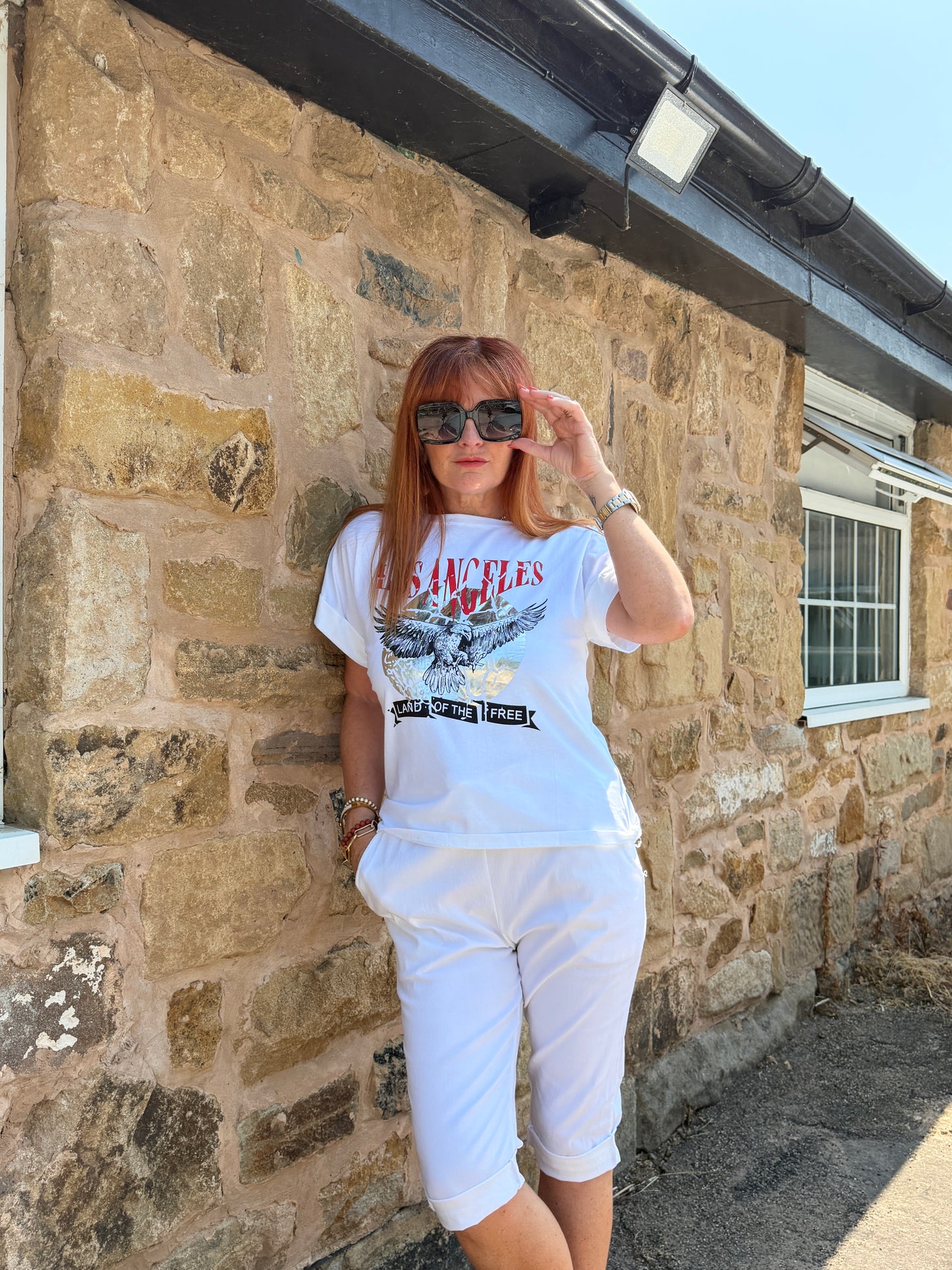Liberty: White “Los Angeles” eagle graphic T shirt. One size: 10-16