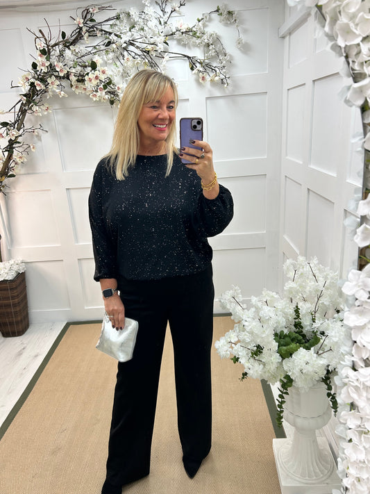 Aura: Black sparkle elastic hem top. One size: 14-18