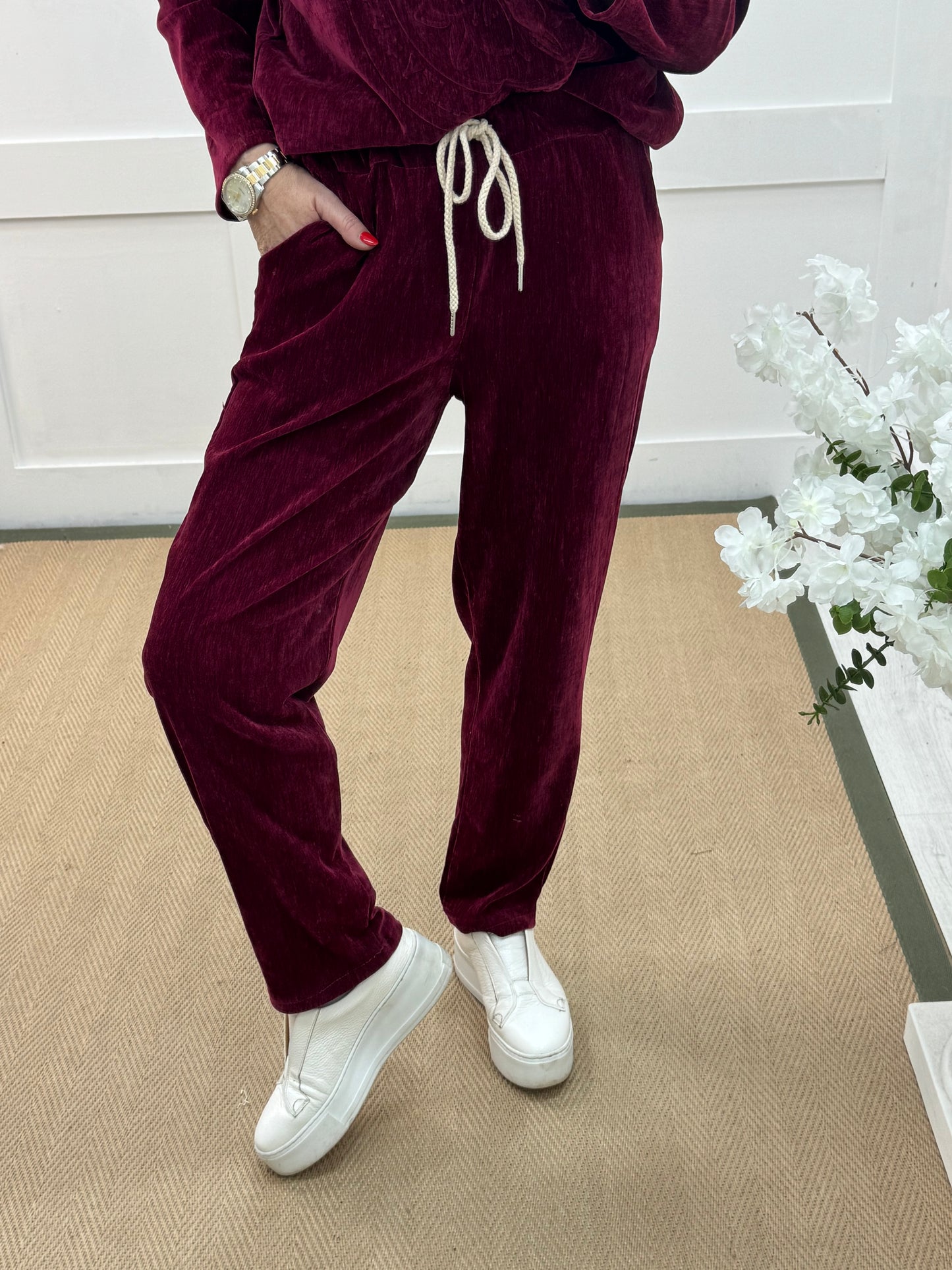 Velma: Burgundy velour trousers. One size: 12-18