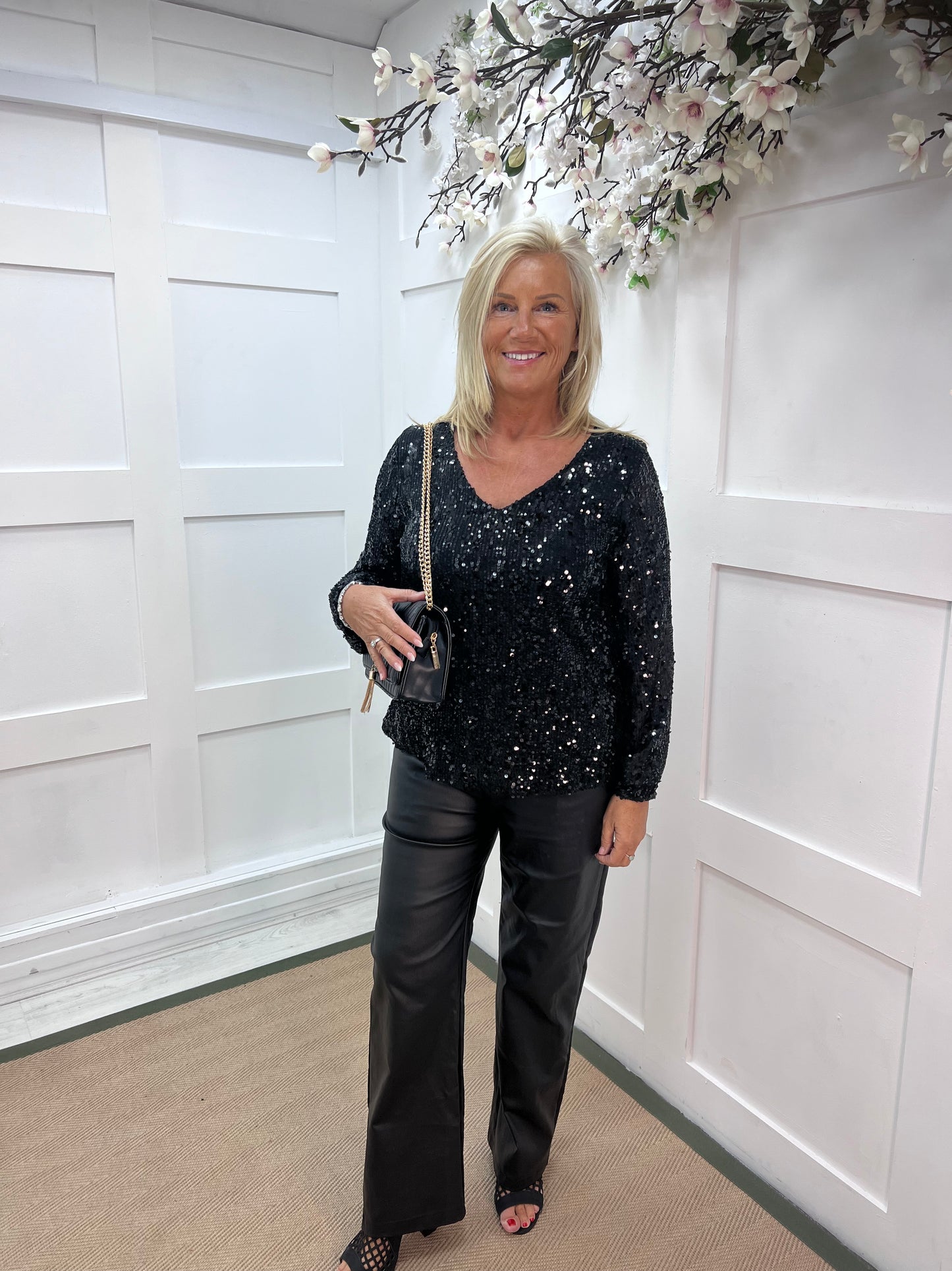 Sutton: Black v-neck sequin top. One size: 12-16