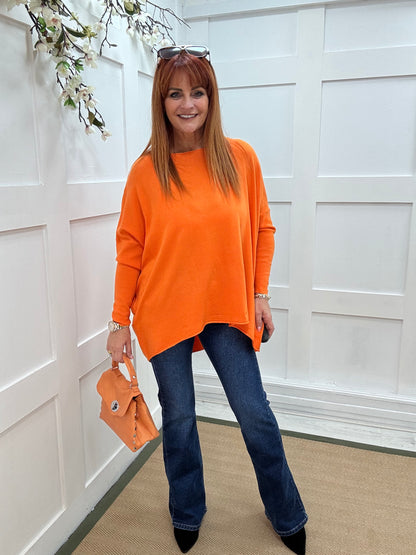 Maddie: Orange oversized long sleeve top. One size: 12-18