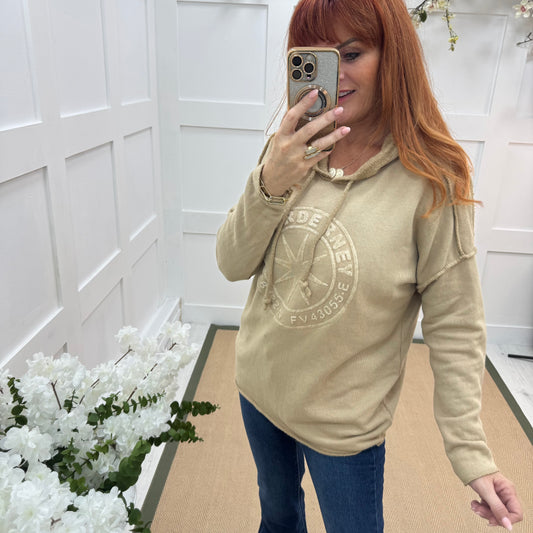 Sara: Sand hooded embossed compass top. One size: 12-18
