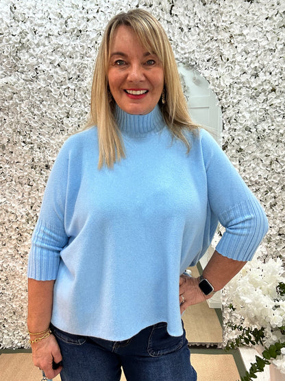 Sammie: Blue high neck knitted top. One Sz: 12-18