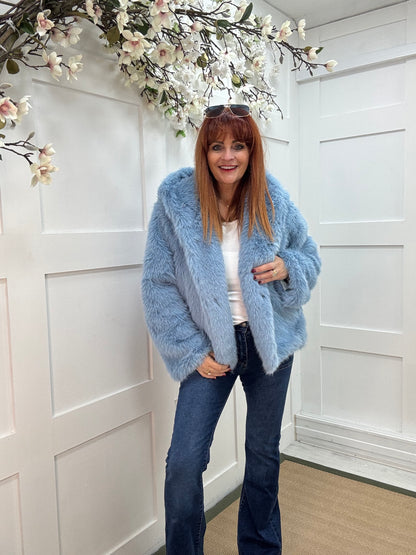 Foxy: Blue short faux fur hooded jacket. One size 12-16