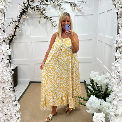 Kandi: Yellow abstract print strappy maxi dress. One size 16-22