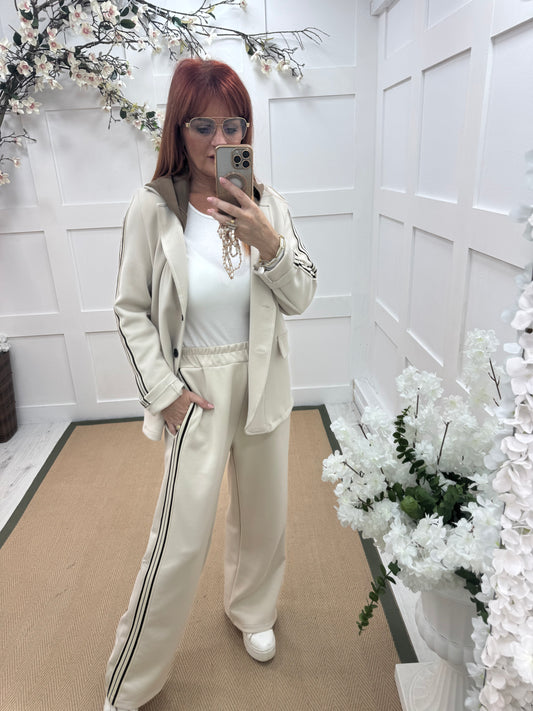 Libby: Cream stretchy sports stripe trousers. One size: 12-16