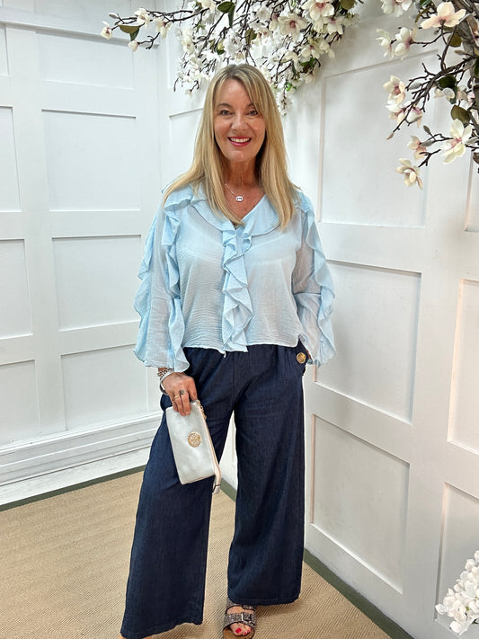 Rowan: Baby blue V neck ruffle blouse. One size 10-16