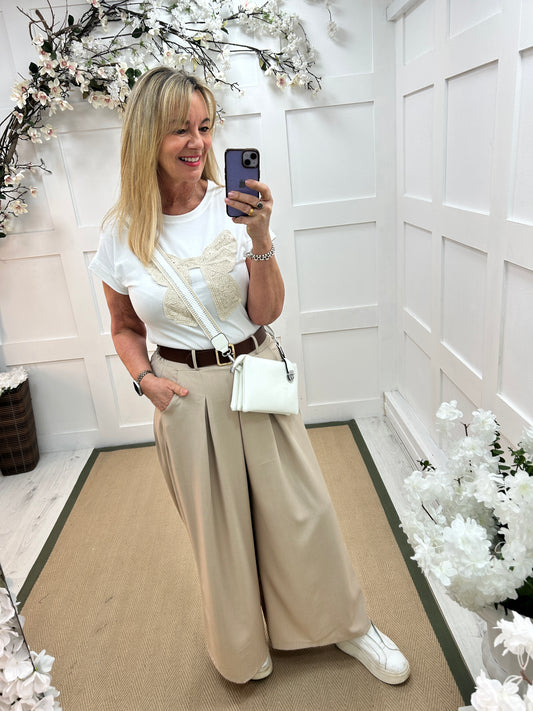 Zina: Beige pocket wide leg trousers. One size: 10-16