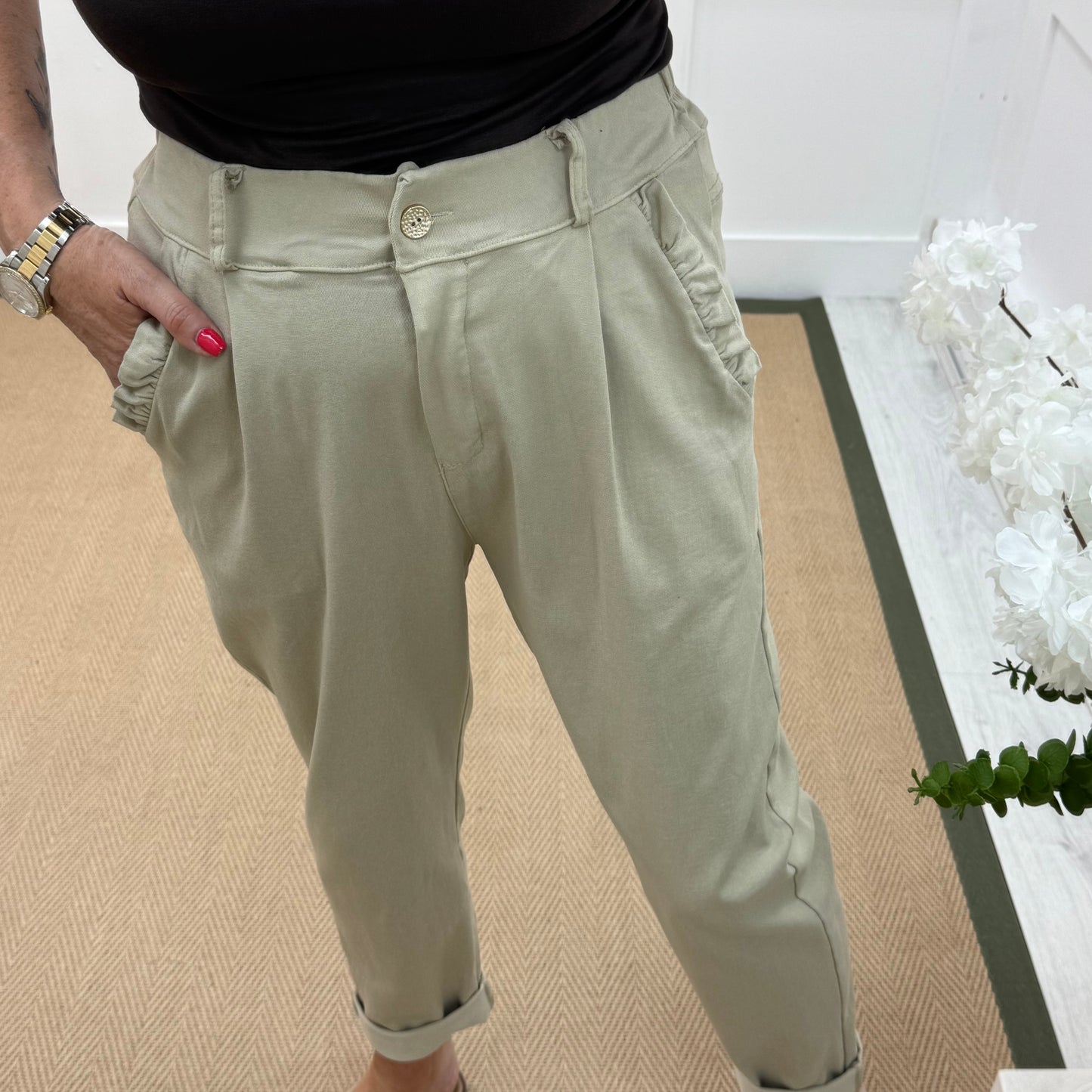 Mandi: Cream stretchy frill pocket magic trousers with rear pockets. One Size: 14-20