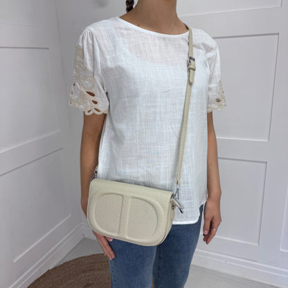 Shellie: Cream leather look cross body/clutch bag