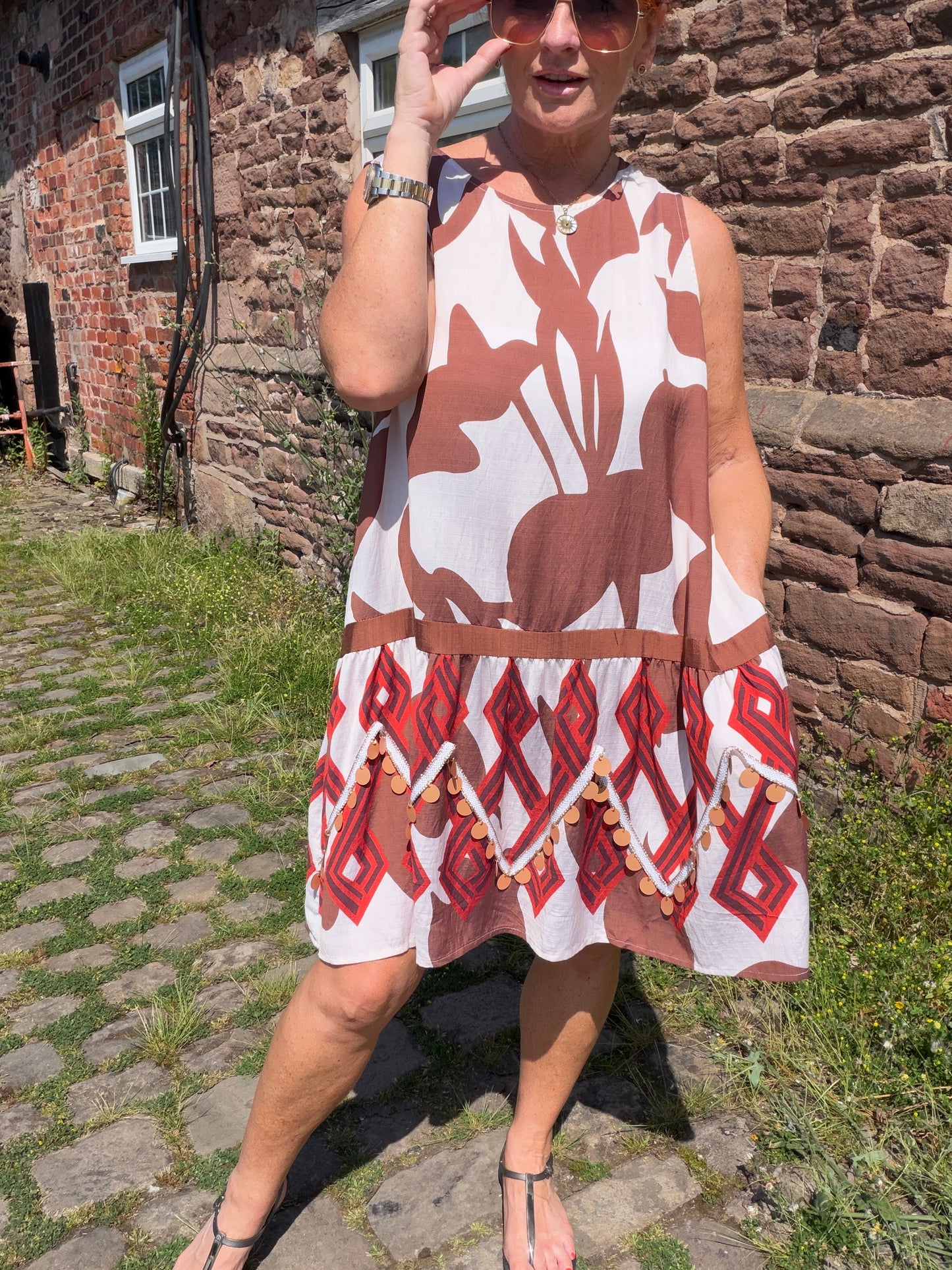 Molly: Leaf printed midi dress with large disc detail. One size: 12-18. 2 colours