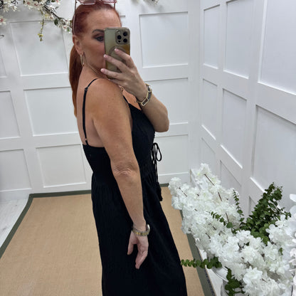 Bria: Black broderie Anglaise strappy jumpsuit. One size: 10-14